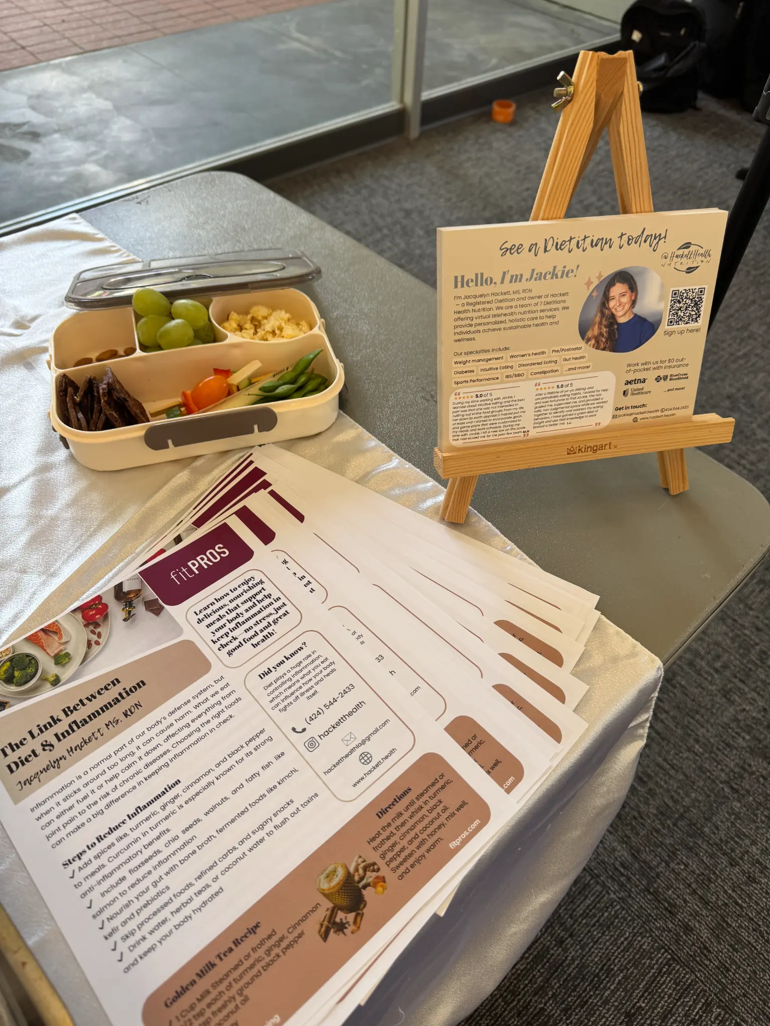 Hackett Health corporate wellness event — booth setup with healthy food samples